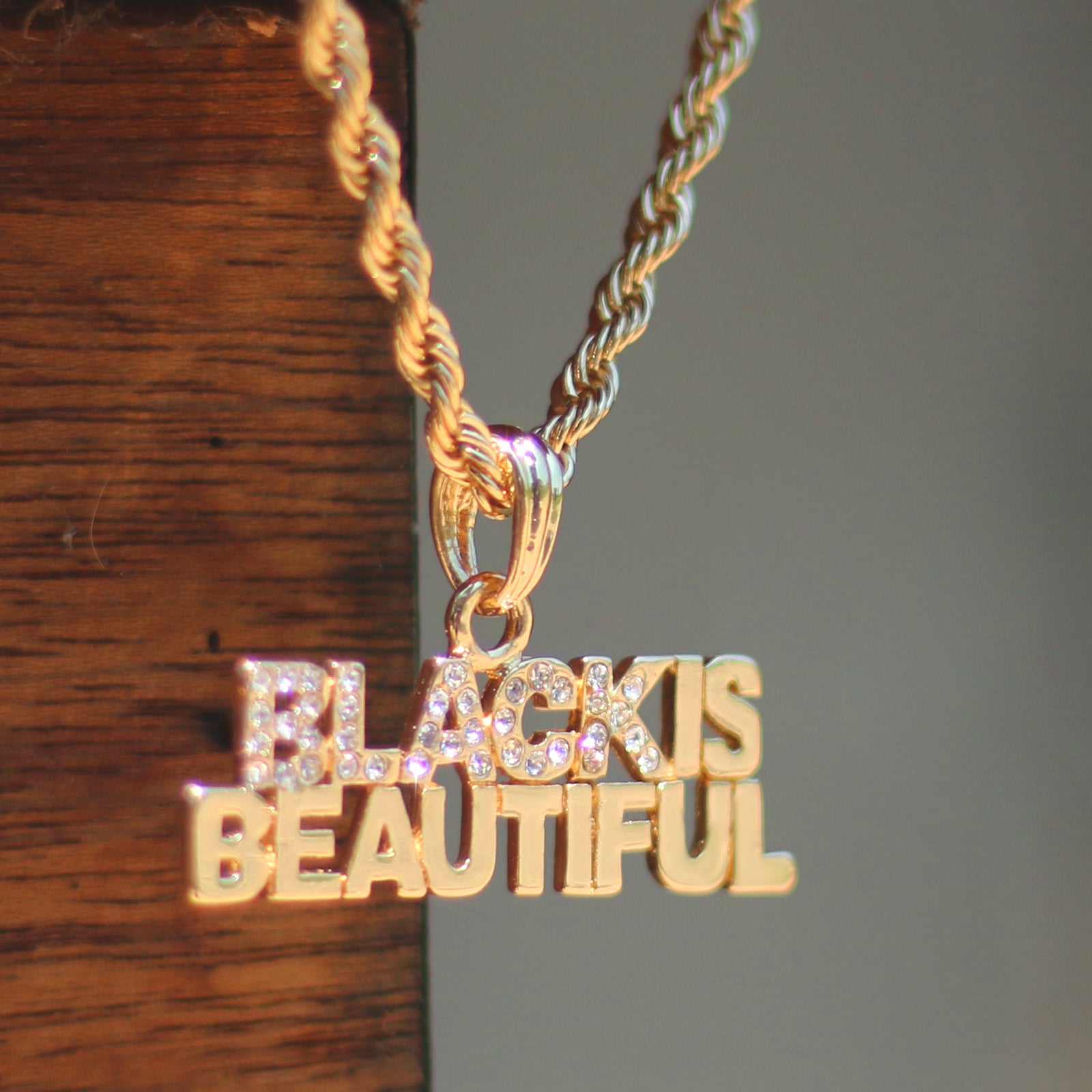 BLACK BEAUTIFUL PENDANT WITH GOLD ROPE